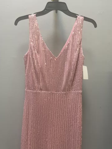 a pink dress hanging on a hanger