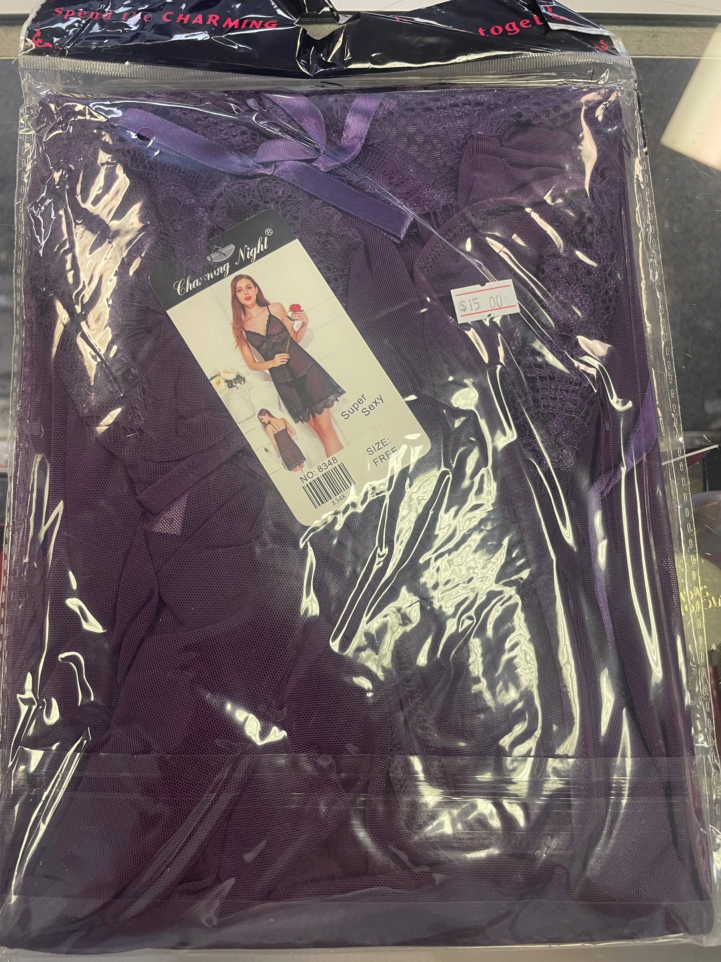 a purple plastic bag with a picture of a woman on it