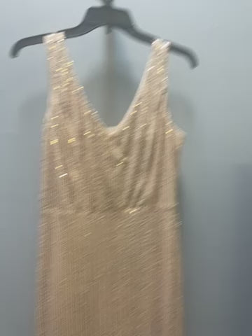 a dress hanging on a hanger in a room