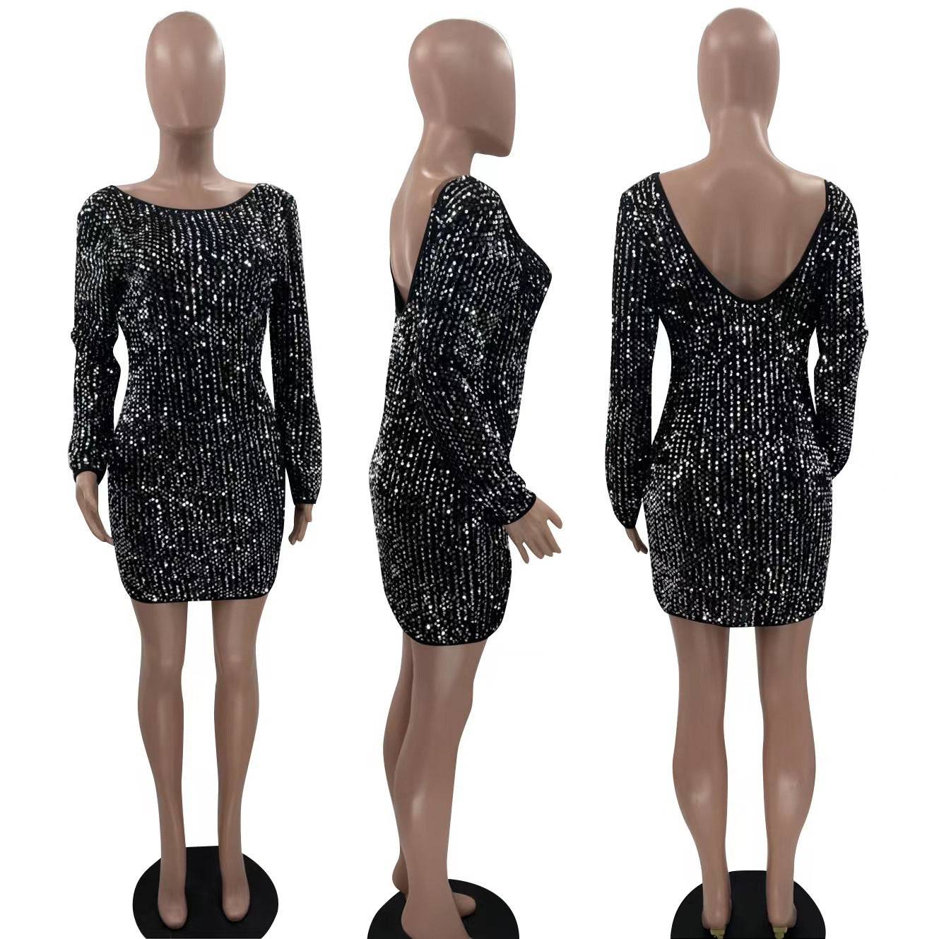 a mannequin wearing a black dress with silver sequins