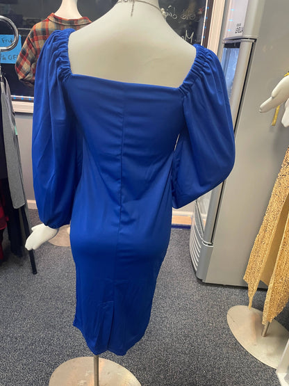 a blue dress on a mannequin in a store