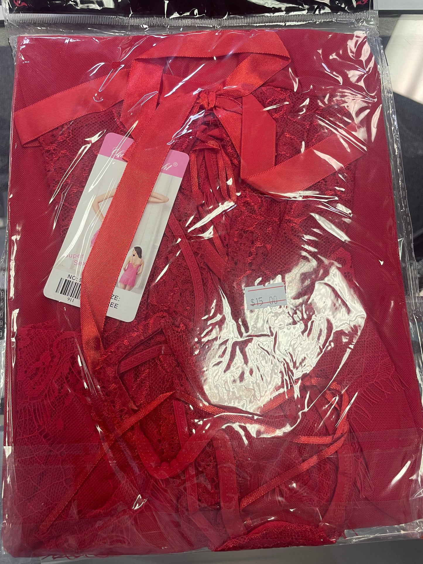 a package of red lace with a red ribbon