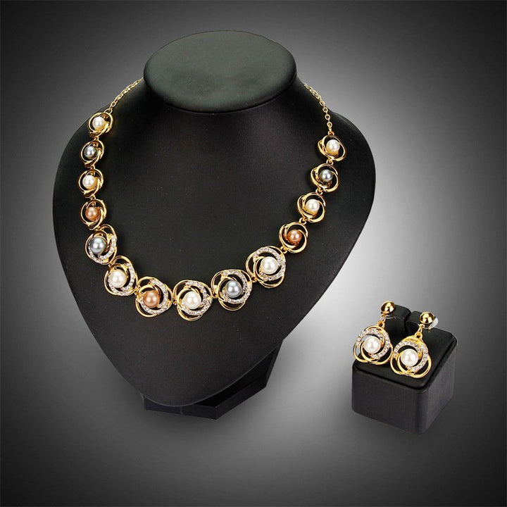 Jewelry set.   Saturn Ring Alloy Pearls earrings and necklace Dubai gold jewelry set