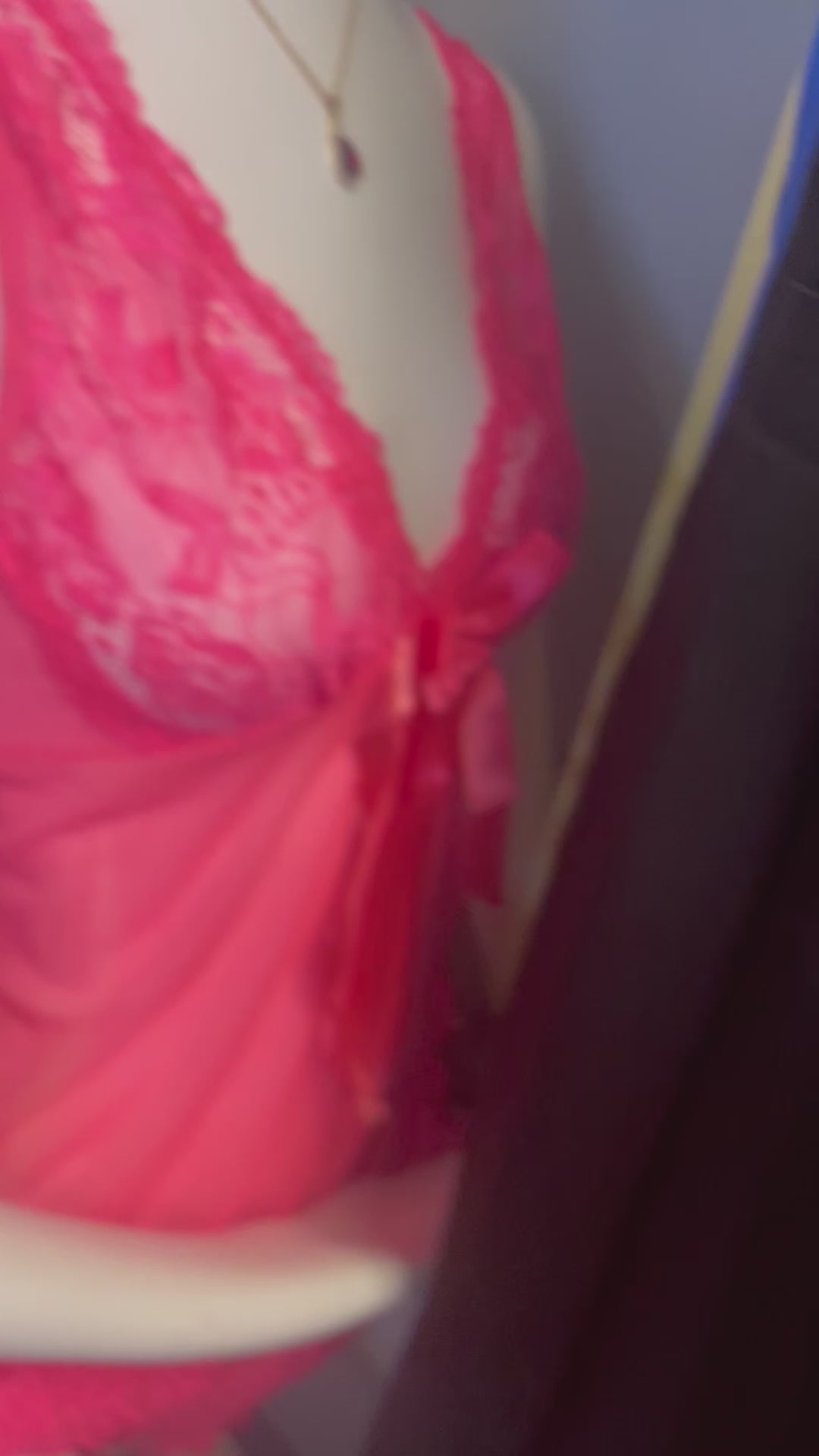 a mannequin wearing a pink bra with a pink bow